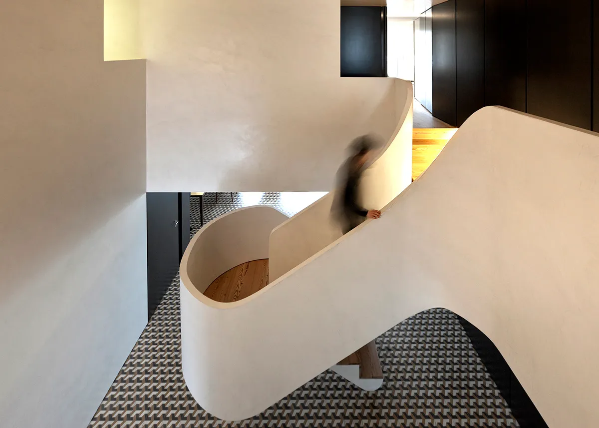 Curved staircase microcement interior